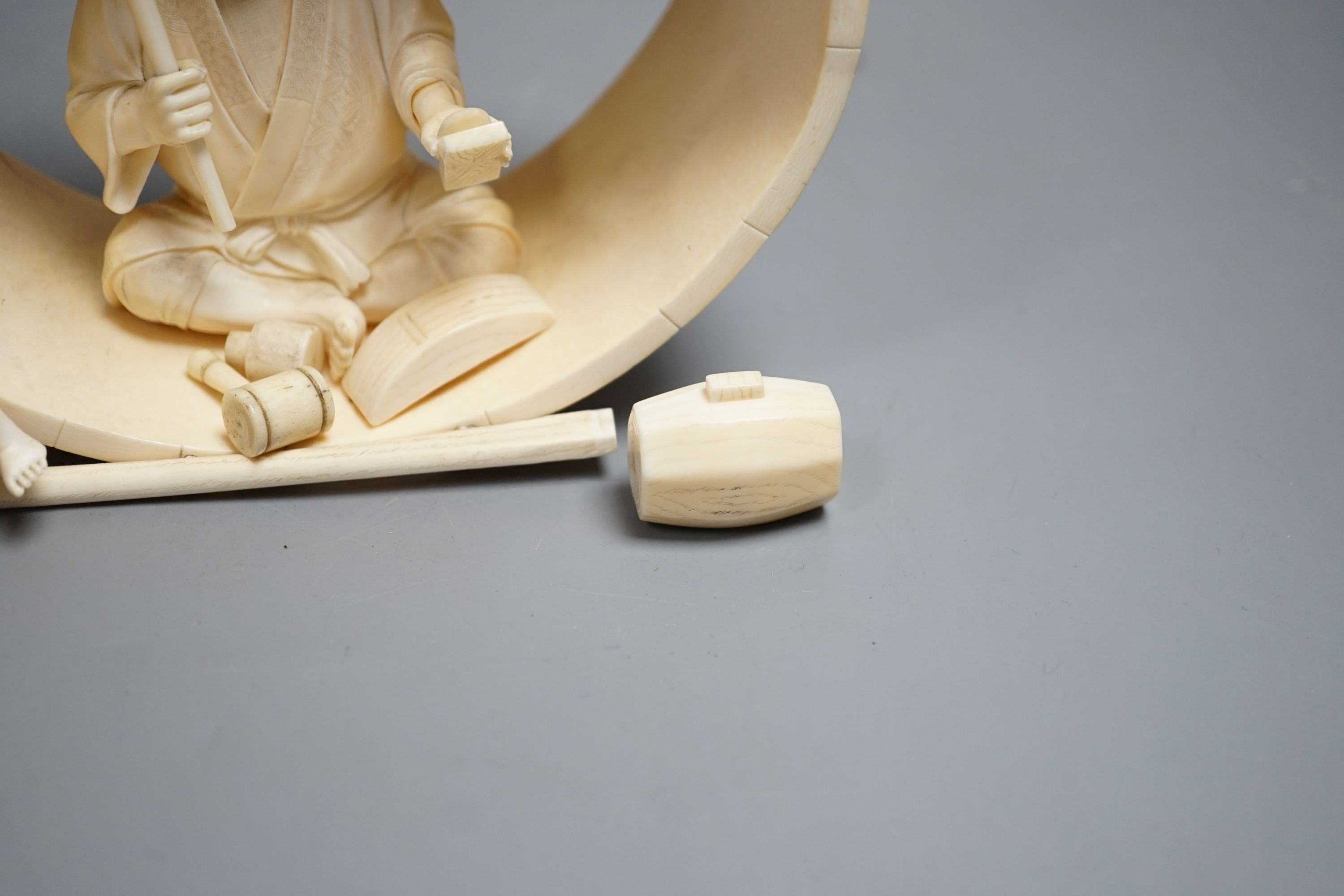 A Japanese ivory okimono of carpenter and child, Meiji period 15cm